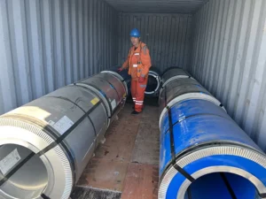 Cold rolled grain oriented steel coils in industrial warehouse