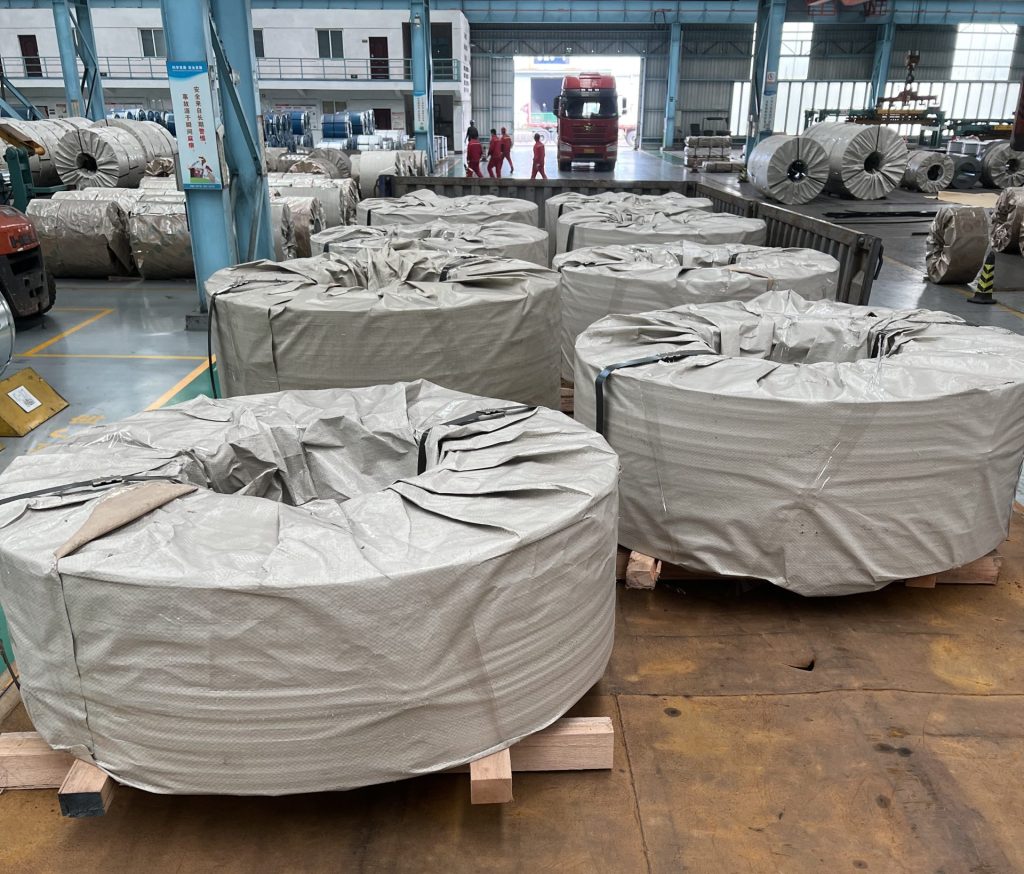 CRGO electrical steel coils wrapped with protective packaging in factory before export delivery