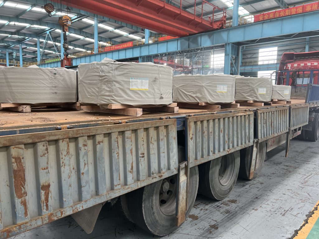 Packed CRGO Hi-B electrical steel coils loaded on truck for export shipment to European customers