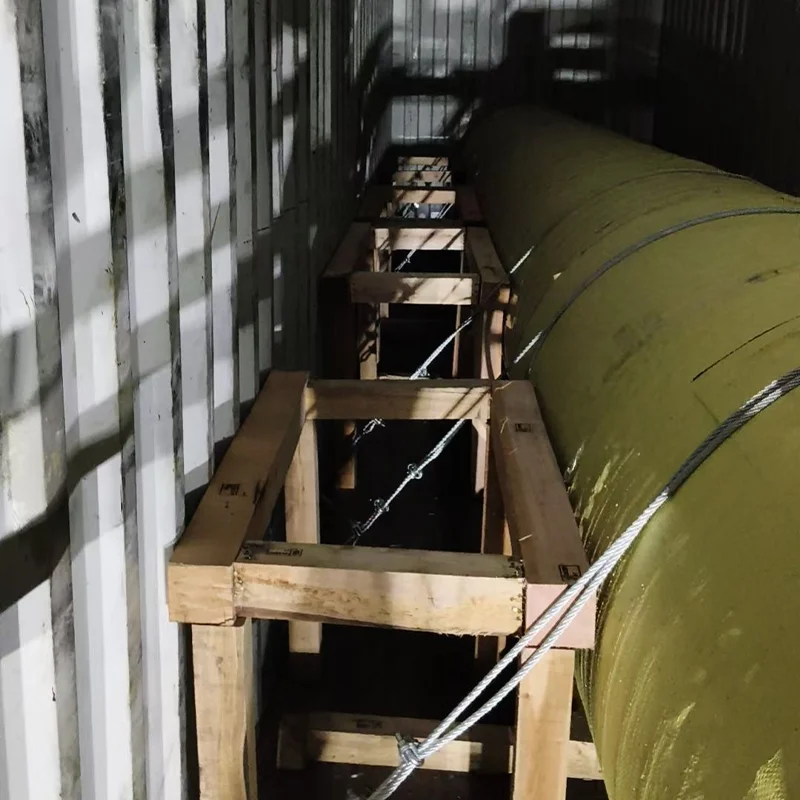 Electrical steel coil secured inside shipping container with wooden cradle support for export