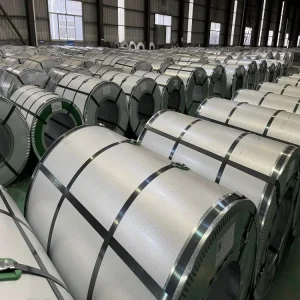 Grain-oriented electrical steel coils stored in warehouse for transformer core manufacturing