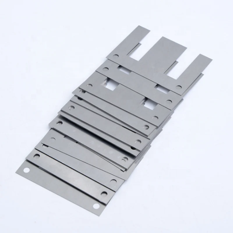 Fanned stack of electrical steel laminations showing individual sheet layers