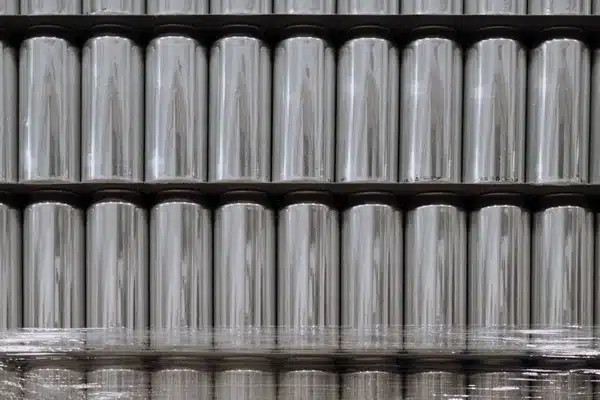 Rows of empty aluminum beverage cans stacked on a pallet, the most common everyday aluminum a magnet won't stick to
