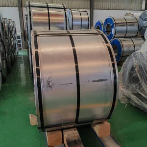 Close-up of coiled cold-rolled grain-oriented electrical steel sheets stacked in an industrial facility