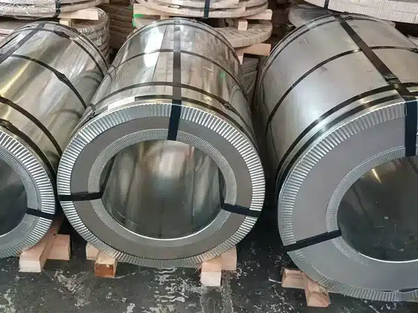 Full-width CRNGO master coils on timber skids, steel-strapped
