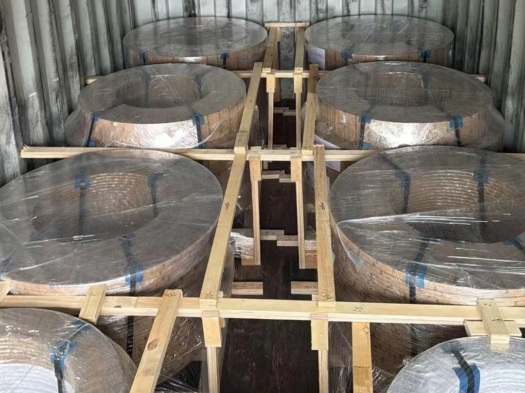 Slit CRGO strip coils loaded inside a container, wrapped in stretch film and separated by a built-up timber dunnage frame