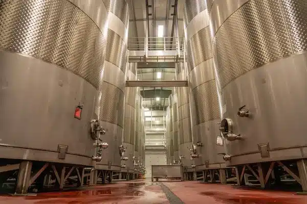Large polished stainless steel fermentation tanks, a common 304 vs 316 stainless steel application