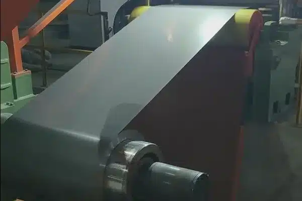 GT-100 ultra-thin grain-oriented master coil threaded on a slitting line uncoiler