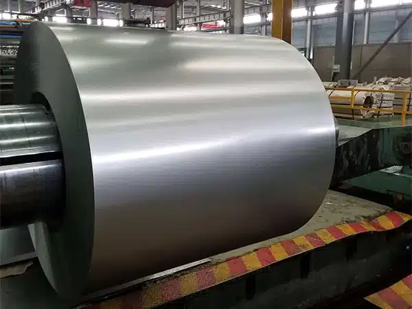 Grain-oriented electrical steel master coil mounted on a decoiler in the slitting workshop