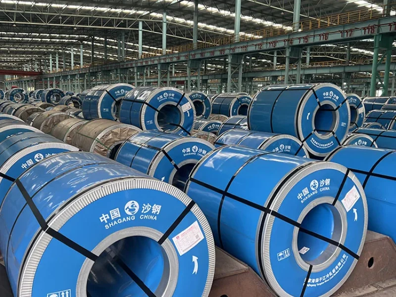 Automated production line processing electrical steel coils in a steel mill